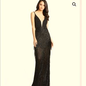 Elegant fully beaded black gown.